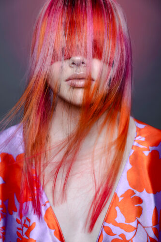 Model with creative coloured hair, focused with a pink undertone. Submitted towards the Coiffure award and being nominated.